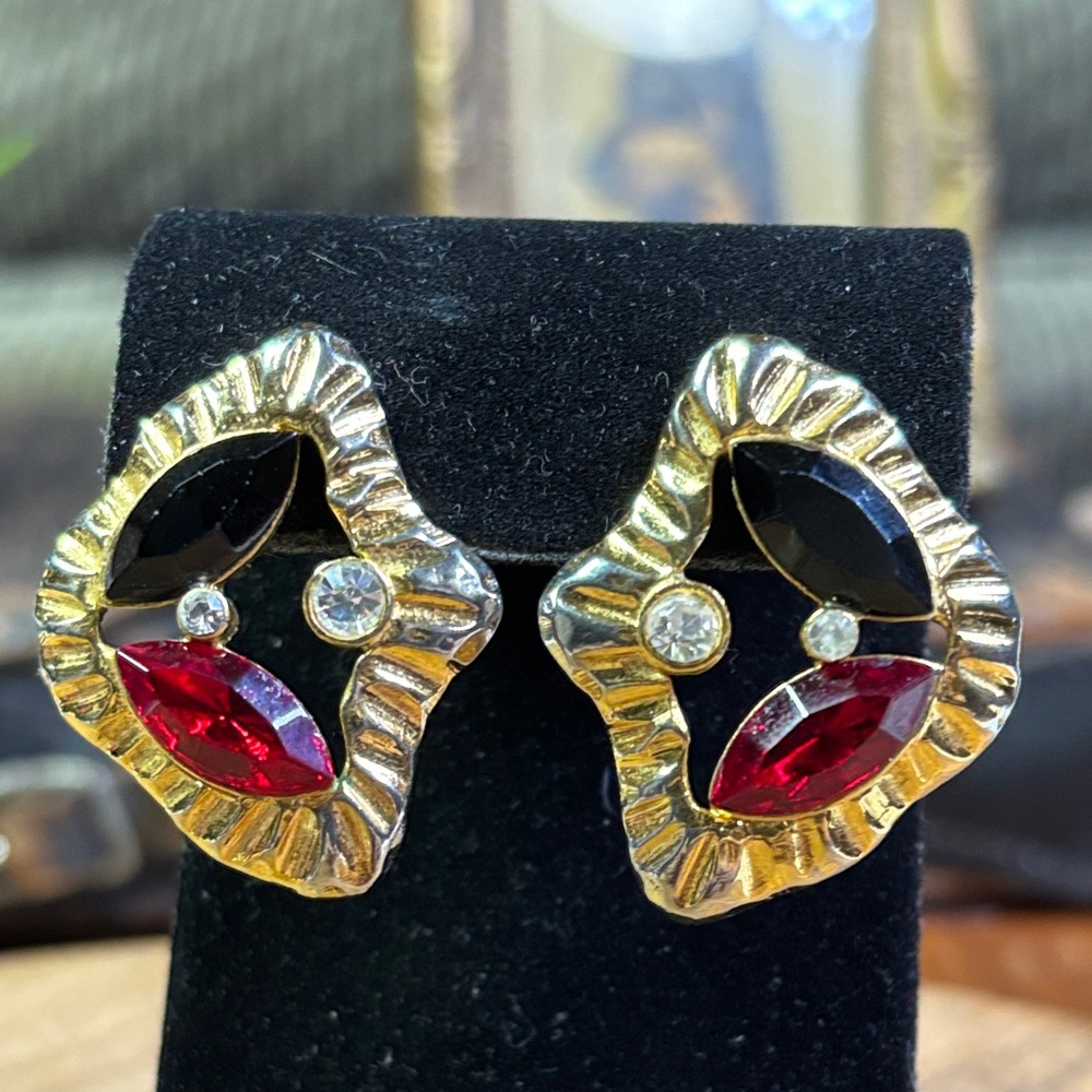 Gold tone earrings with red & black glass stones
